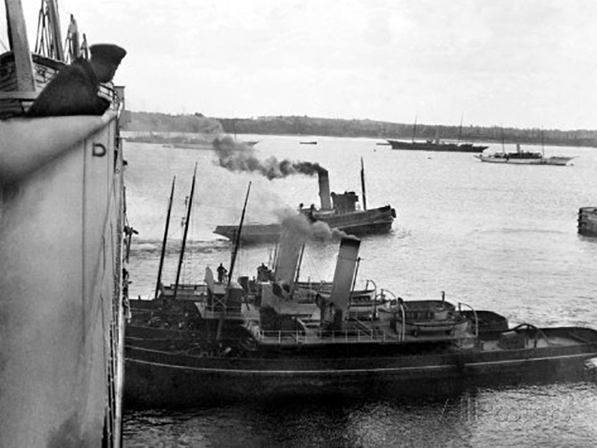Titanic leaving Southampton with tugs assisting